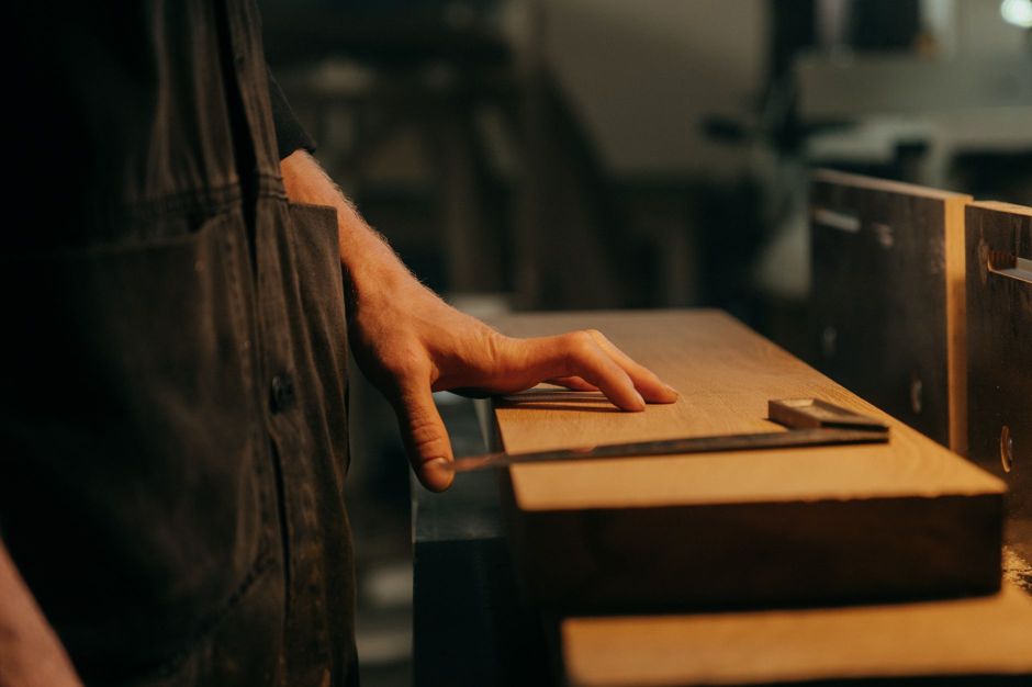 Craftsman measuring with precision